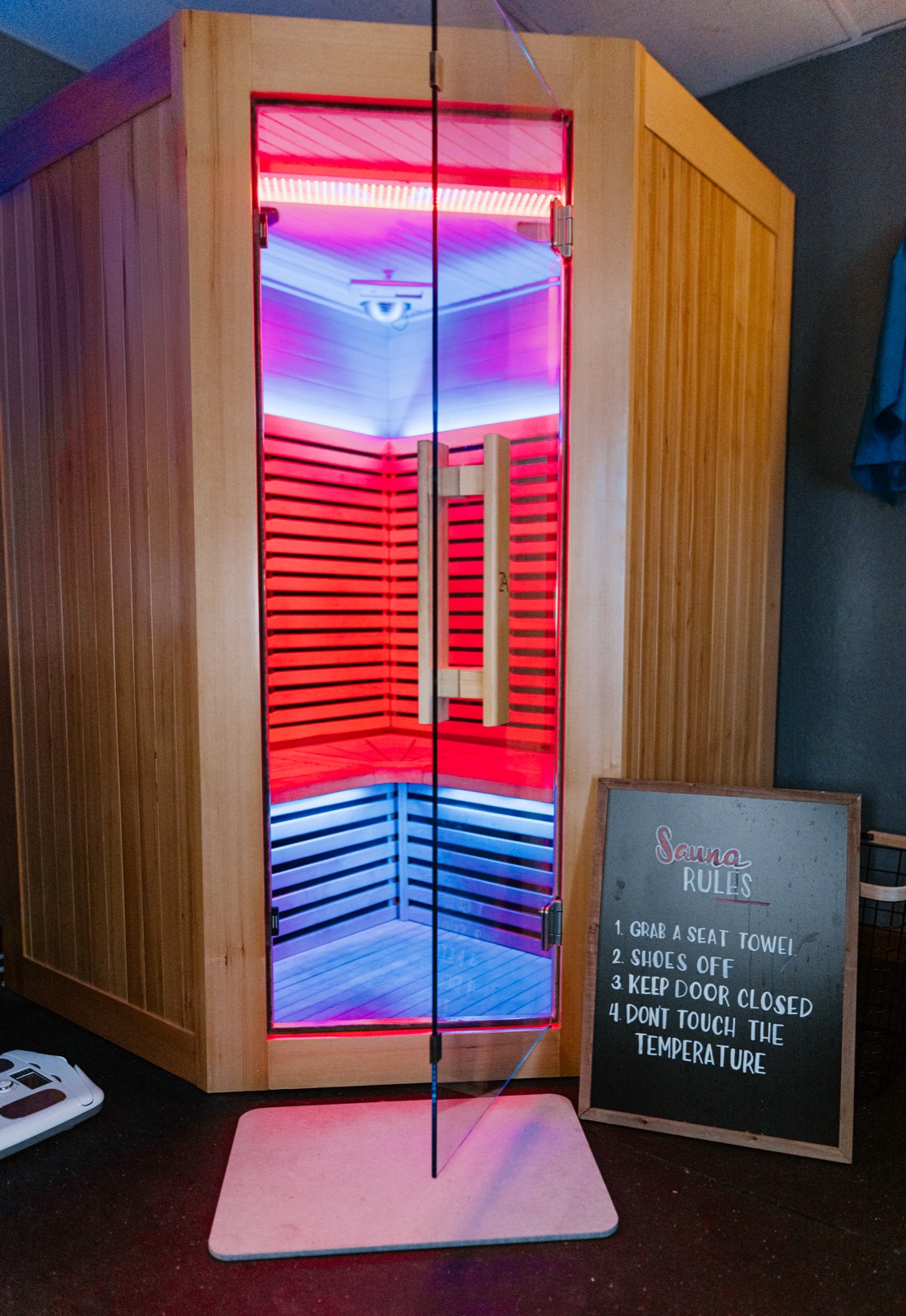 Full spectrum infrared sauna glowing red at Heat & Chill Recovery