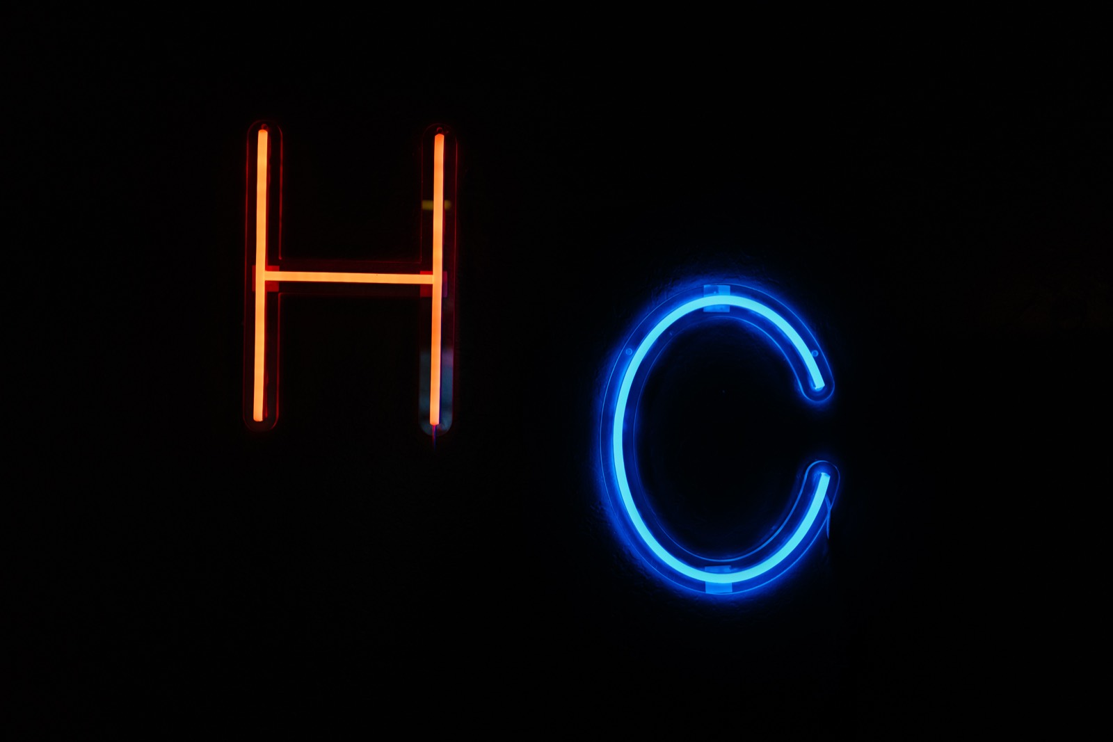 Heat & Chill neon sign — orange H and blue C